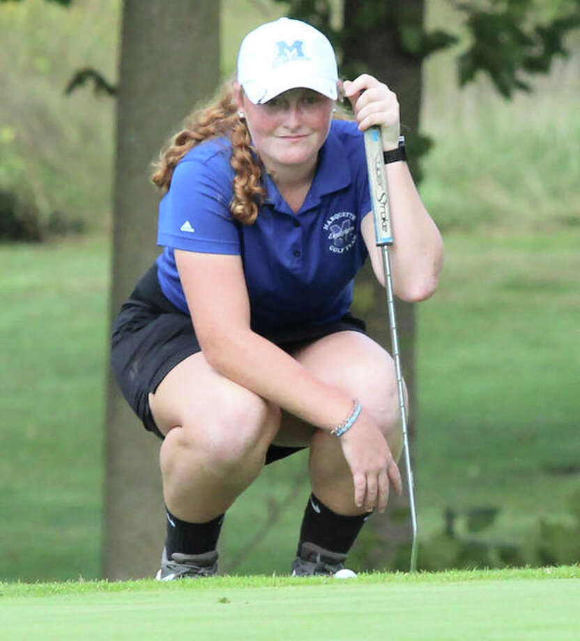 Marquette Catholic freshman Gracie Piar, shown lining up a putt in the regional last week at Okawville, shot 80 to lead the Explorers to a third-place finish and state berth Monday at the Centralia Class 1A Sectional. Photo: Greg Shashack / The Telegraph