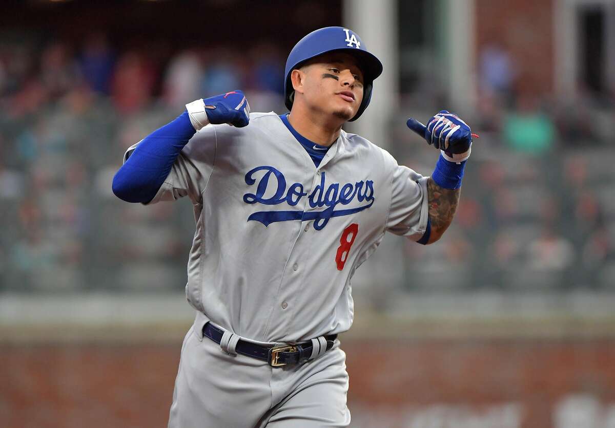 The Los Angeles Dodgers' Manny Machado reacts after his three-run home run in the seventh inning against the Atlanta Braves in Game 4 of a National League Division Series on Monday, Oct. 8, 2018, in Atlanta. The Dodgers won, 6-2, to advance. (Hyosub Shin/Atlanta Journal-Constitution/TNS)