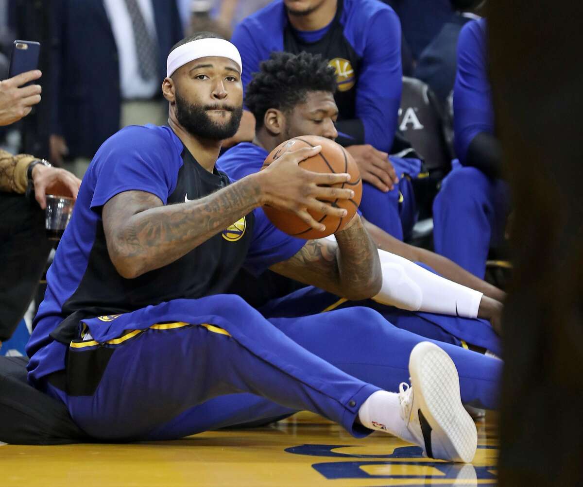 Golden State Warriors' DeMarcus Cousins catches loose ball in 1st quarter against Phoenix Suns during NBA preseason game at Oracle Arena in Oakland, Calif. on Monday, October 8, 2018.