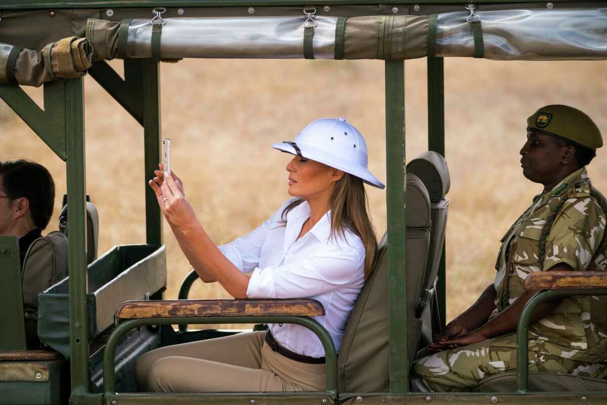 First lady Melania Trump takes a photo as she visits Nairobi National Park in Kenya, Oct. 5, 2018. During her first solo trip abroad, the first lady said people should focus on what she does, not what she wears. But she still seems dedicated to dressing a part, Vanessa Friedman writes. (Doug Mills/The New York Times)