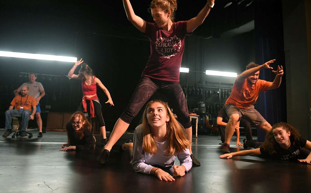 Kristen Malisewski, (on floor from left), Lucy Campbell, and Jordynn Godrey, and Ann Marie Boyd (standing from left), Kelly McMichael, and Josef Anderson work a dance scene during a rehearsal of the upcoming Stageworks Theatre production of "A Christmas Carol" at The Lone Star College - Cy-Fair Performing Arts Center on Sept. 26, 2018.