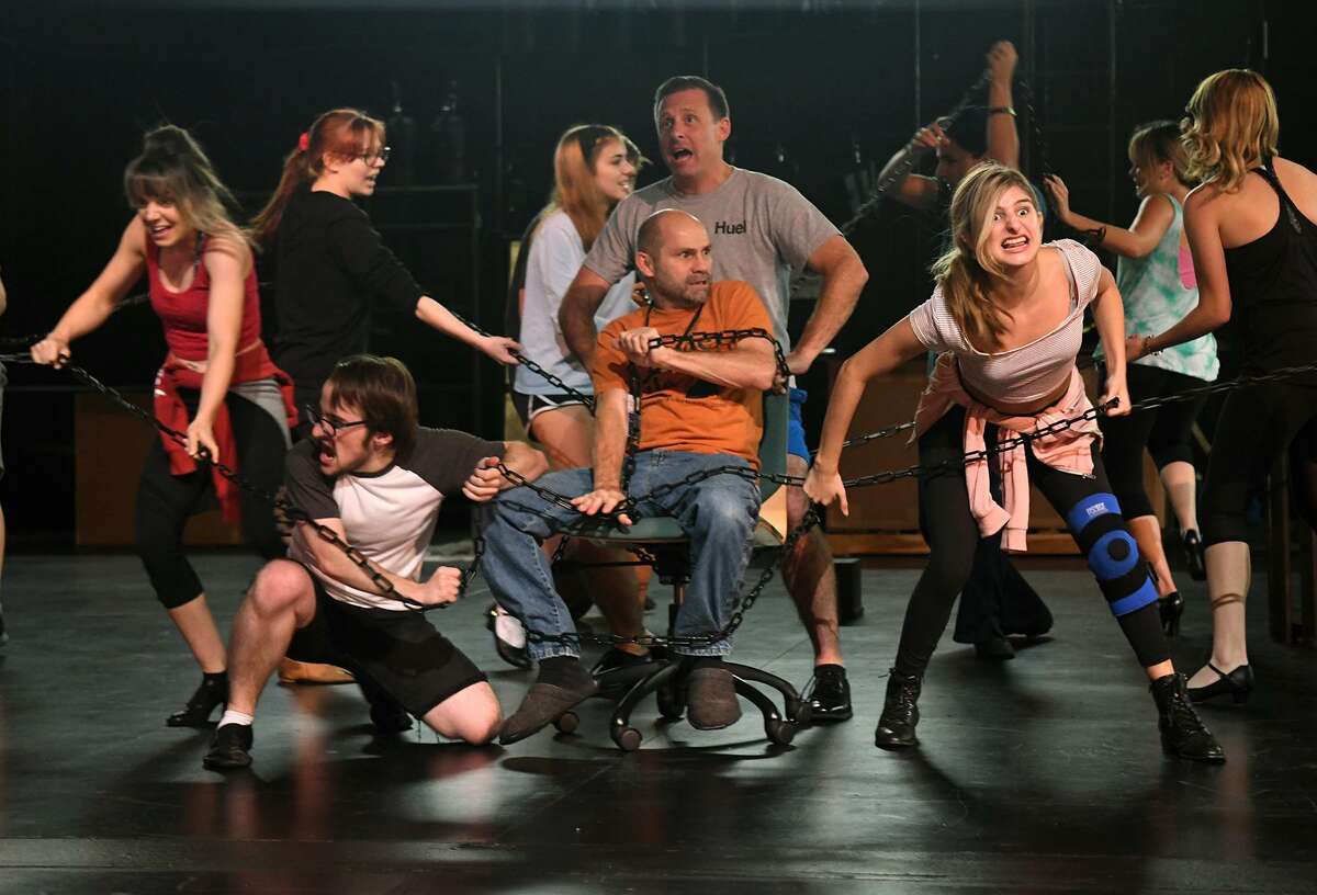 Ann Marie Boyd, front from left, Nathan Crooks, Brad Zimmerman, and Ashland Noss, and Kristen Malisewski, back from left, Lucy Campbell, Brandon Hahs, Sol Carlos, and work a dance scene during a rehearsal of the upcoming Stageworks Theatre production of "A Christmas Carol" at The Lone Star College - Cy-Fair Performing Arts Center on Sept. 26, 2018.