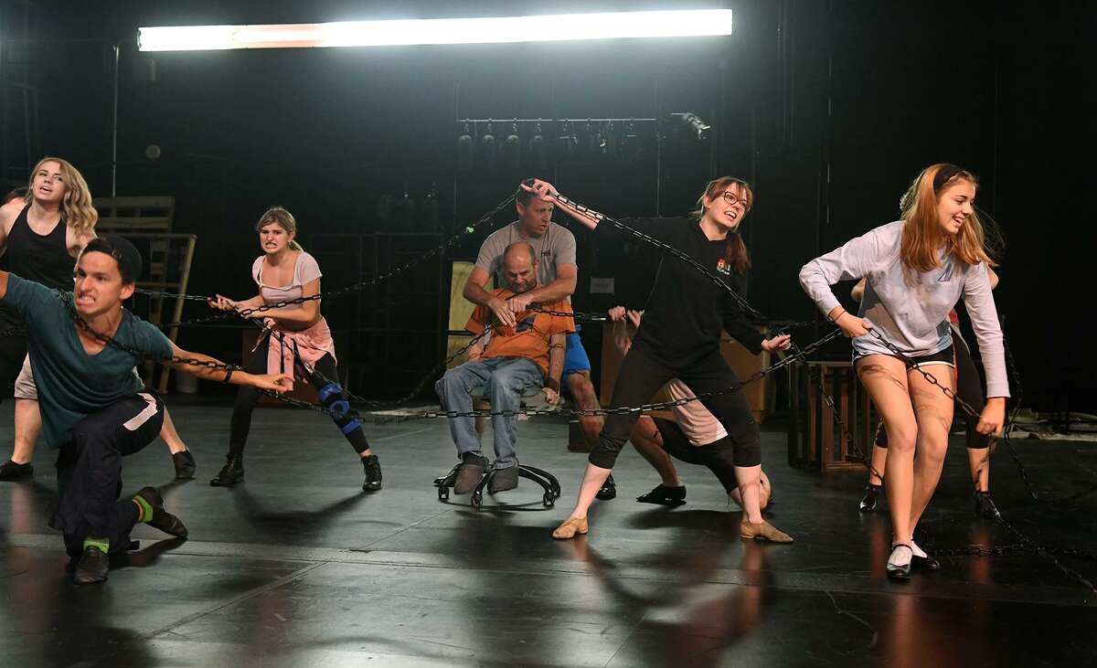 Emily Horne, from left, Joshua Godfrey, Sol Carlos, Brad Zimmerman ("Ebenezer Scrooge"), Brandon Hahs ("Jacob Marley"), Kristen Malisewski, and Lucy Campbell work a dance scene during a rehearsal of the upcoming Stageworks Theatre production of "A Christmas Carol" at The Lone Star College - Cy-Fair Performing Arts Center on Sept. 26, 2018.