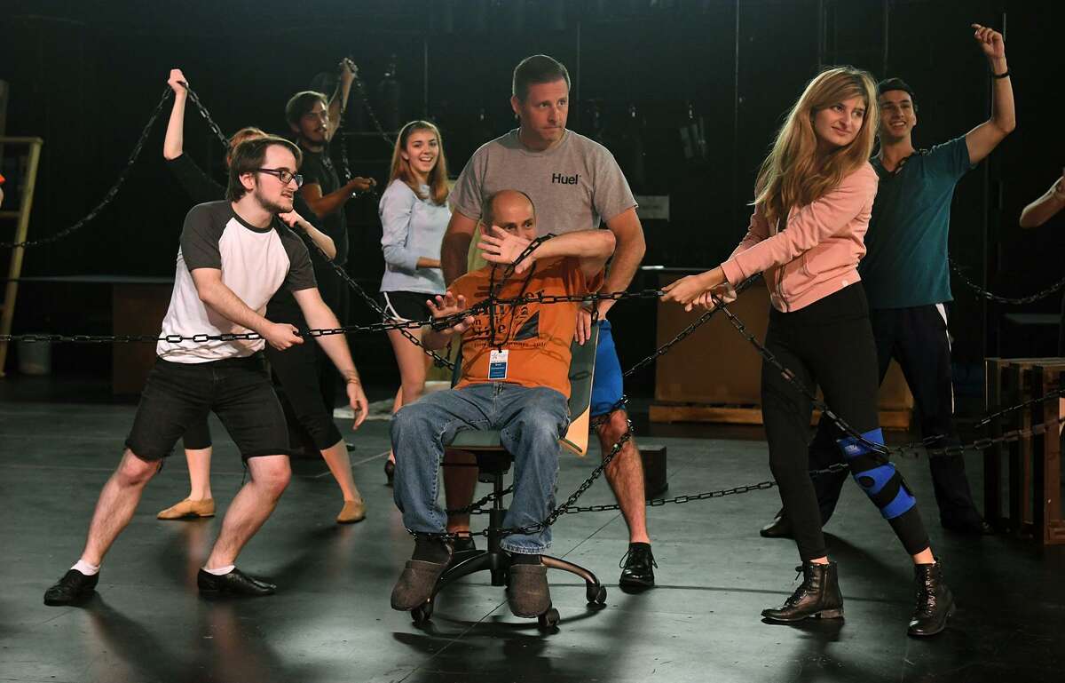 Nathan Crooks, front from left, Lucy Campbell, Brad Zimmerman (Ebenezer Scrooge), Brandon Hahs (Jacob Marley), and Ashland Noss, and Lucy Campbell (back left to right) and Sol Carlos work a dance scene during a rehearsal of the upcoming Stageworks Theatre production of "A Christmas Carol" at The Lone Star College - Cy-Fair Performing Arts Center on Sept. 26, 2018.