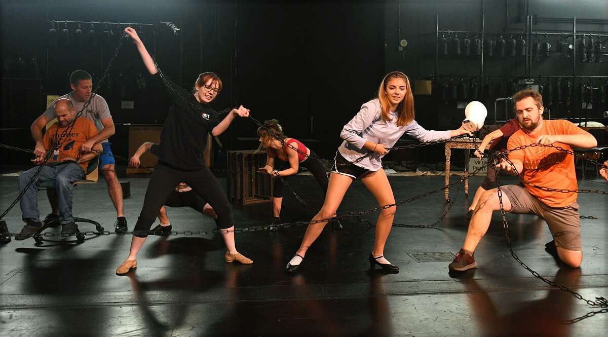 Brad Zimmerman (Ebenezer Scrooge), from left, Brandon Hahs (Jacob Marley), Kristen Malisewski, Ann Marie Boyd, Lucy Campbell, and Josef Anderson work a dance scene during a rehearsal of the upcoming Stageworks Theatre production of "A Christmas Carol" at The Lone Star College - Cy-Fair Performing Arts Center on Sept. 26, 2018.