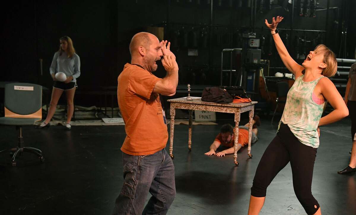 Brad Zimmerman, left, of Cypress, who will play "Scrooge", works a dance scene with Ashley Cooper during a rehearsal of the upcoming Stageworks Theatre production of "A Christmas Carol" at The Lone Star College - Cy-Fair Performing Arts Center on Sept. 26, 2018.