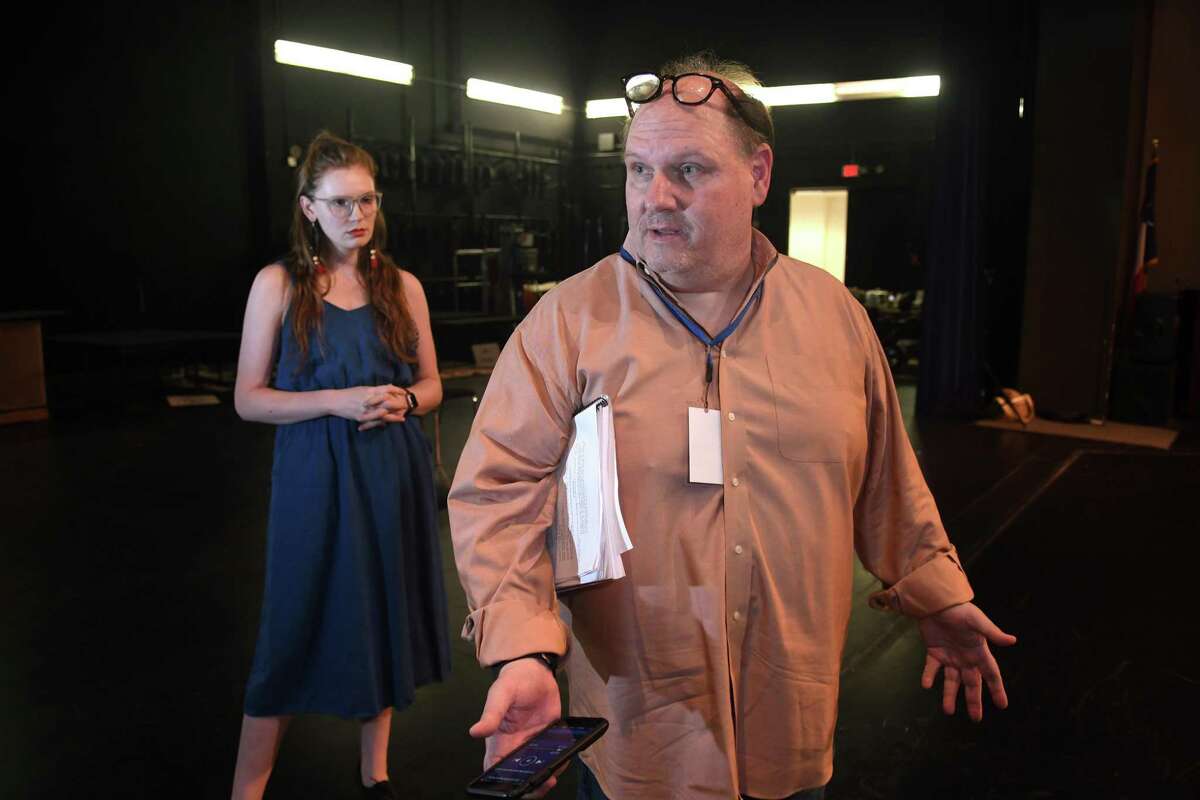 Courtney Berry, left, of Spring, who will play "The Ghost of Christmas Past", listens to stage instructions from Director Michael Montgomery, of Cypress, during a rehearsal of the upcoming Stageworks Theatre production of "A Christmas Carol" at The Lone Star College - Cy-Fair Performing Arts Center on Sept. 26, 2018.