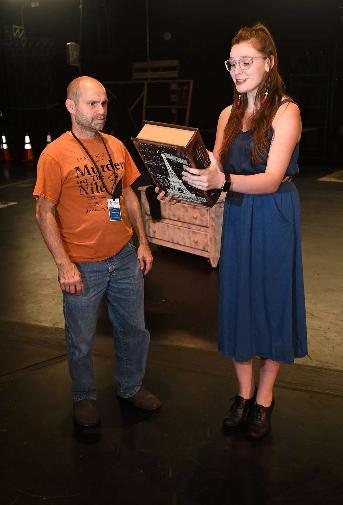 Brad Zimmerman, left, of Cypress, who will play "Scrooge", and Courtney Berry, of Spring, who takes the part of "The Ghost of Christmas Past", work a scene during a rehearsal of the upcoming Stageworks Theatre production of "A Christmas Carol" at The Lone Star College - Cy-Fair Performing Arts Center on Sept. 26, 2018.