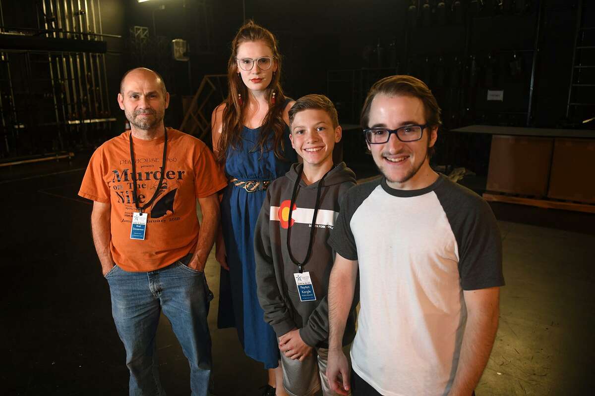 Brad Zimmerman, from left, of Cypress, who will play "Scrooge", Courtney Berry, of Spring, who takes the part of "The Ghost of Christmas Past", and Peyton Kargel, 13, a 7th grader at Spillane Middle School, and Nathan Crooks, of Cypress, who will play the "Acolytes", take a break during a rehearsal of the upcoming Stageworks Theatre production of "A Christmas Carol" at The Lone Star College - Cy-Fair Performing Arts Center on Sept. 26, 2018.