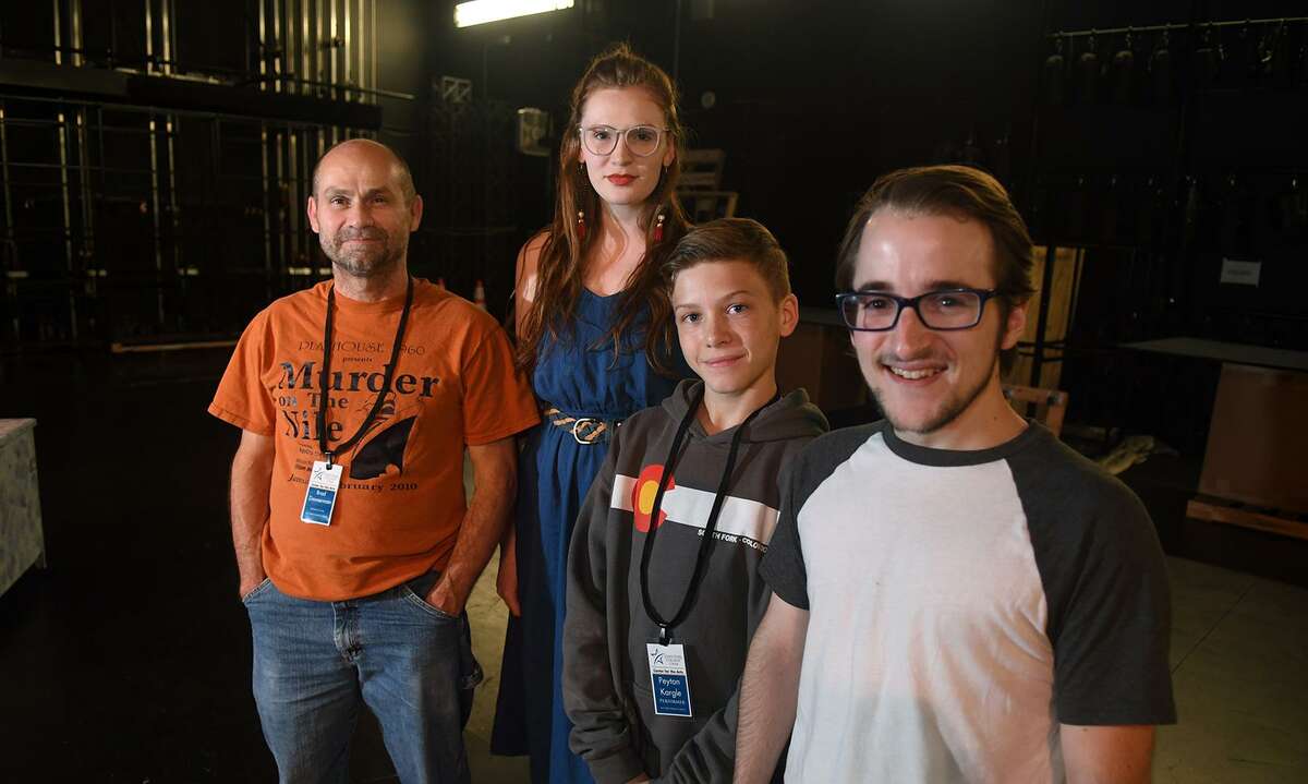 Brad Zimmerman, from left, of Cypress, who will play "Scrooge", Courtney Berry, of Spring, who takes the part of "The Ghost of Christmas Past", and Peyton Kargel, 13, a 7th grader at Spillane Middle School, and Nathan Crooks, of Cypress, who will play the "Acolytes", take a break during a rehearsal of the upcoming Stageworks Theatre production of "A Christmas Carol" at The Lone Star College - Cy-Fair Performing Arts Center on Sept. 26, 2018.