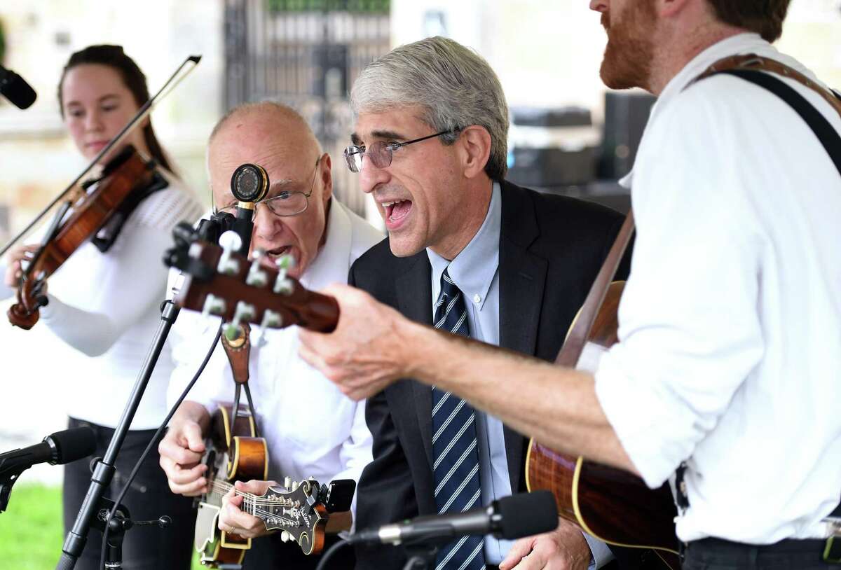 Yale University President Peter Salovey, center, joins the Bluegrass Characters for a few songs at Founders Day Tuesday in New Haven.