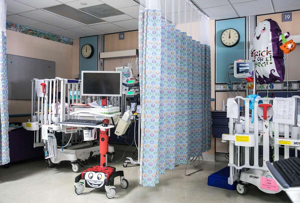 Thin curtains are all that separates patient beds inside the Pediatric Intensive Care Unit at UCSF Benioff Children's Hospital in Oakland, Calif. Wednesday, Oct. 3, 2018.