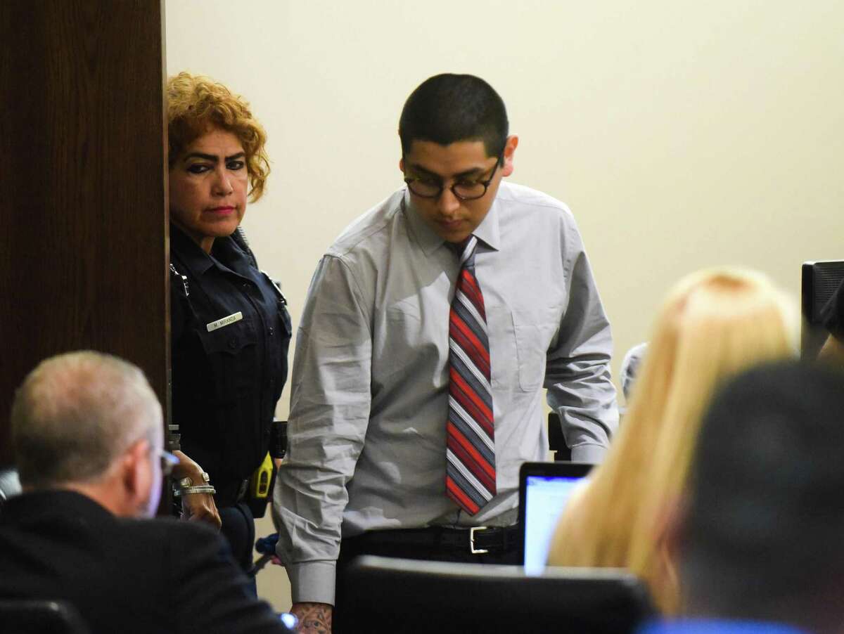 Jonathan Perales, who is accused of the capital murder death of Michael Clayton Robinson, who was a physician's assistant in Universal City, enters the courtroom of Judge Melisa Skinner on Tuesday, Oct. 9, 2018.