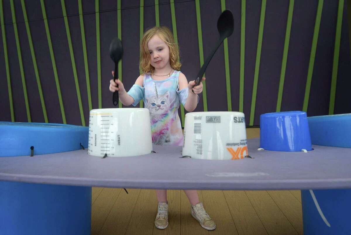 Caitlin McGrath, 5, plays on the Found Sound exhibit which repurposes household items as musical instruments at Stepping Stones Museum for Children Tuesday, October 9, 2018, in Norwalk, Conn. Stepping Stones will host its first ever Sustainability Expo, partnering with Fairfield-based business Sustainne, which promotes sustainable living. The expo will run 10 am to 2 p.m. this Saturday.