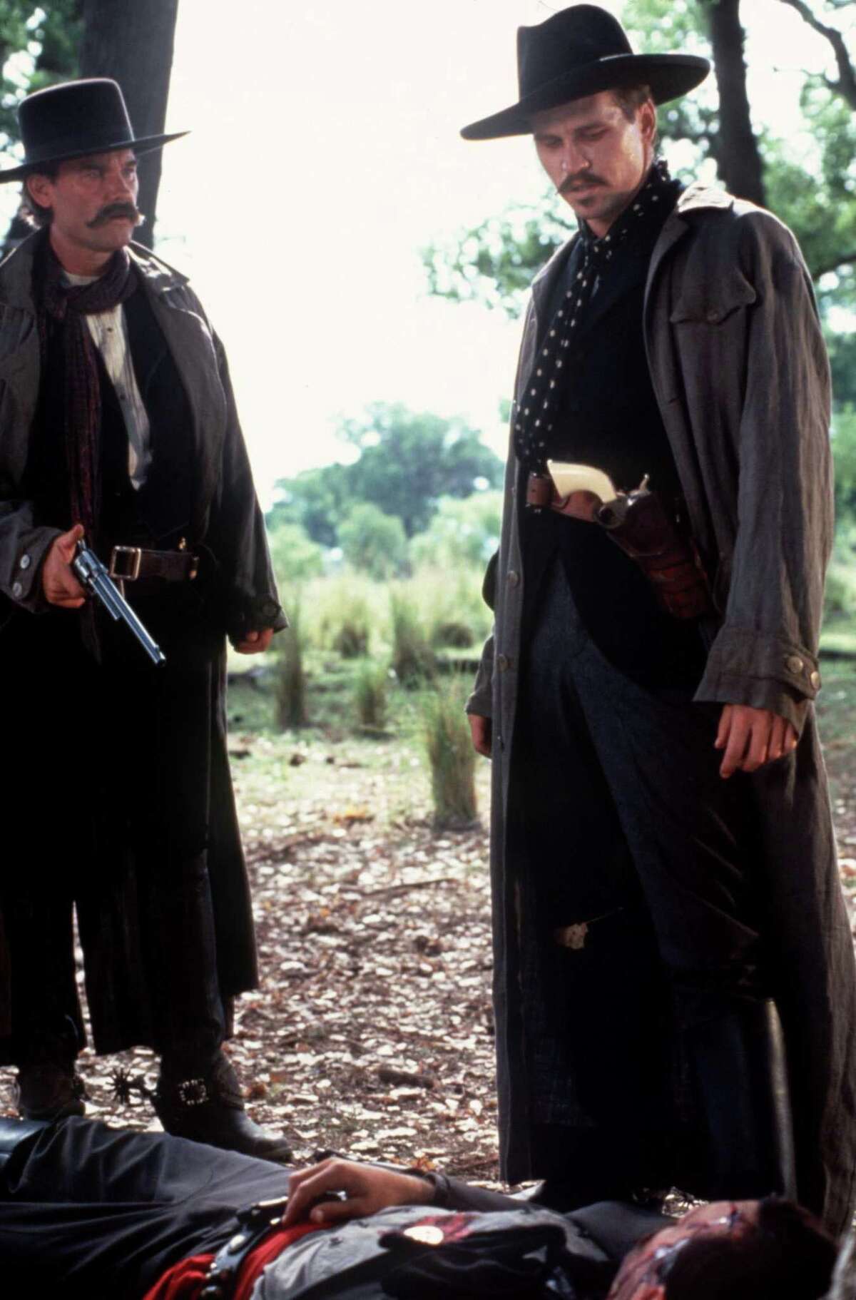Kurt Russell, left, and Val Kilmer star in “Tombstone.”