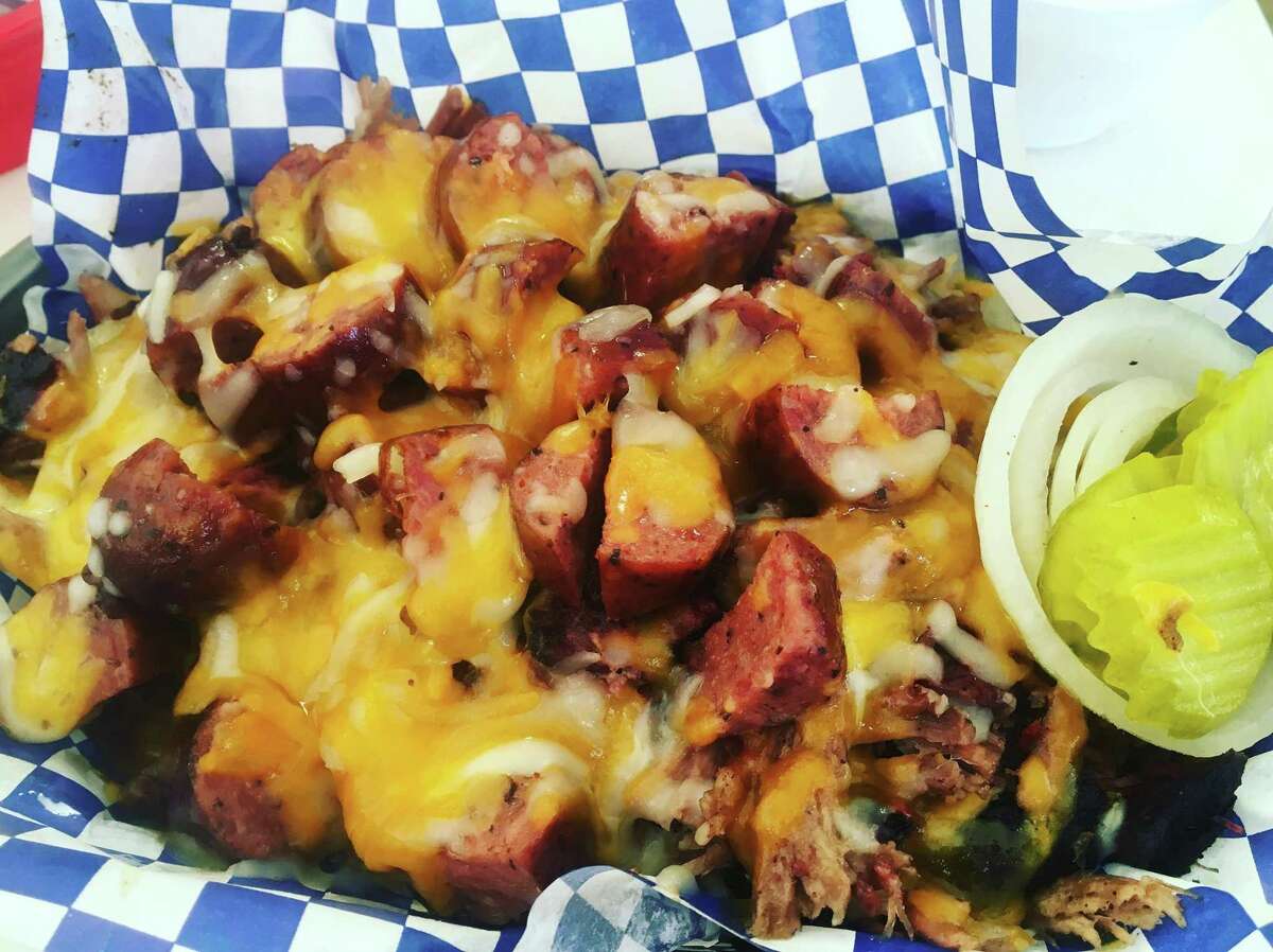 The Spread, is a mixture of brisket, sausage and melted cheddar cheese over a bed of Lay's original potato chips. It's a BBQ Life special for $9.25.