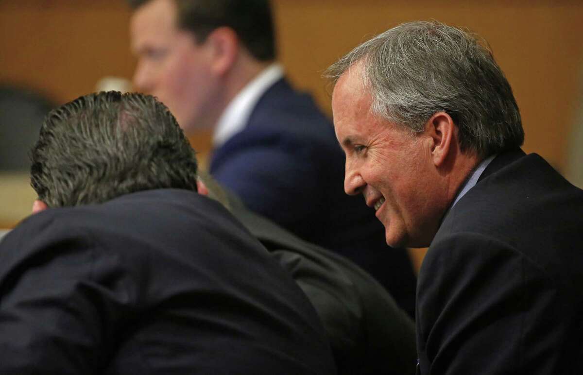 Texas Attorney General Ken Paxton (right) smiles during his pretrial hearing at Collin County Courthouse in McKinney, Texas, Thursday, Feb. 16, 2017. (Jae S. Lee/The Dallas Morning News)