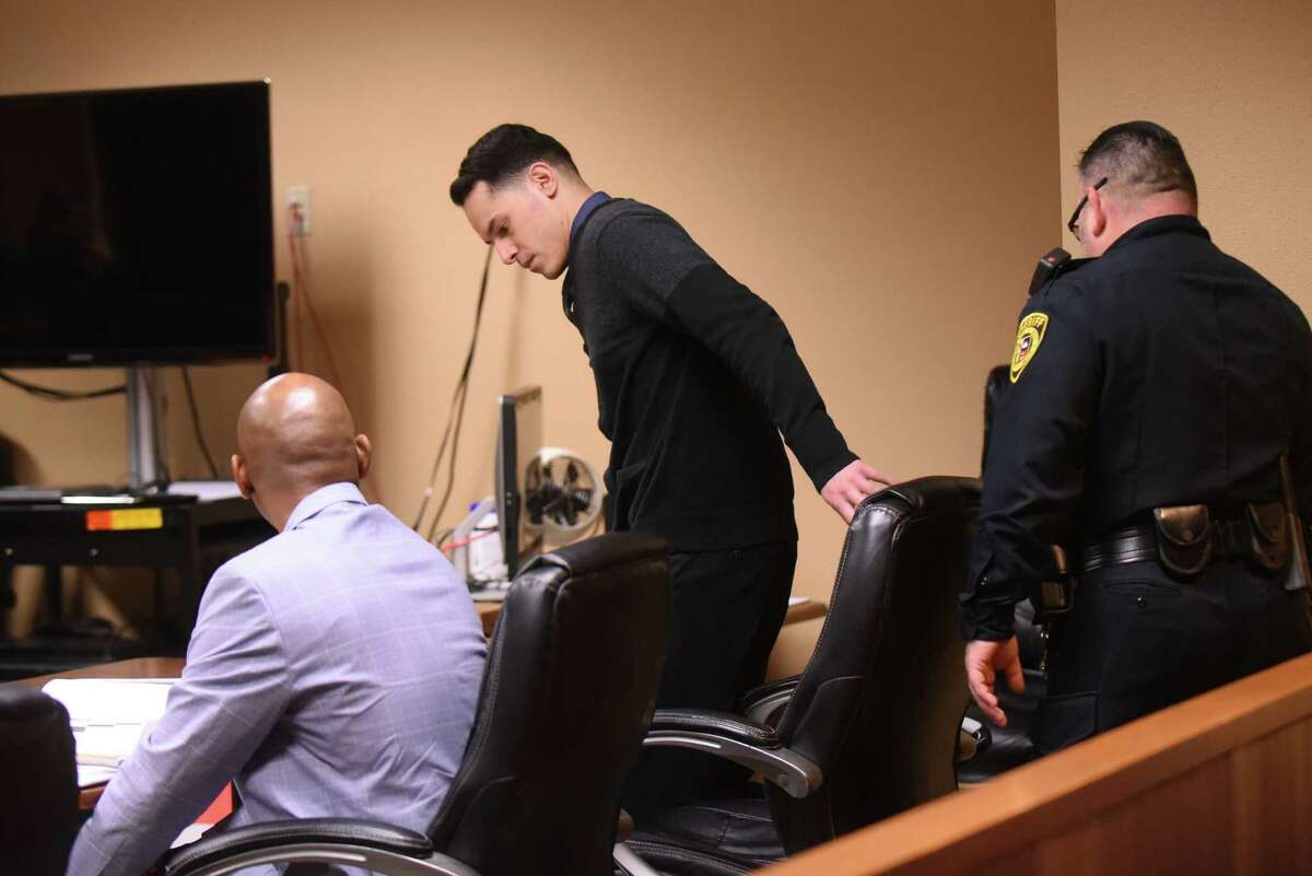 Defendant Adrian Vigil, who is accused of two counts of super aggravated sexual assault on a minor, enters the courtroom of Judge Philip A. Kazen on Tuesday, Oct. 9, 2018.