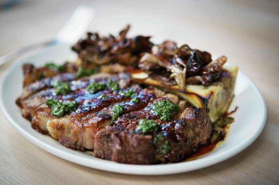 First Look Eunice Restaurant Houston Chronicle Grilled Ribeye Yukon Gold Potatoes Bone Marrow Wild Mushrooms And Salsa Verde At Eunice