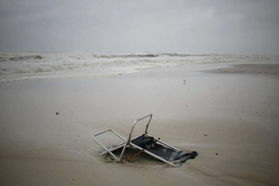 An abandoned beach chair is seen on the beach ahead of Hurricane Michael in Panama City Beach, Florida, U.S., on Wednesday, Oct. 10, 2018. Investors are tracking�Hurricane�Michael�as it barrels toward Florida with winds strengthening to 145 miles per hour, posing potential consequences for companies in the building, hospital, insurance and energy industries, among others. The Category 4 storm, poised to be the strongest to hit the continental U.S. since 2004, is�expected�to make landfall Wednesday and could cause $16 billion in damage. Photographer: Luke Sharrett/Bloomberg Photo: Luke Sharrett, Bloomberg