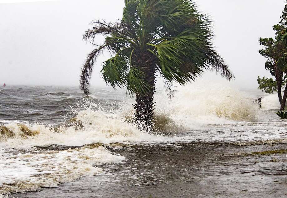The storm surge and waves from Hurricane Michael batter the beachfront homes on October 10, 2018 in the Florida Panhandle community of Shell Point Beach, Florida. The hurricane is forecast to hit the Florida Panhandle at a possible category 4 storm.  Photo: Mark Wallheiser, Getty Images