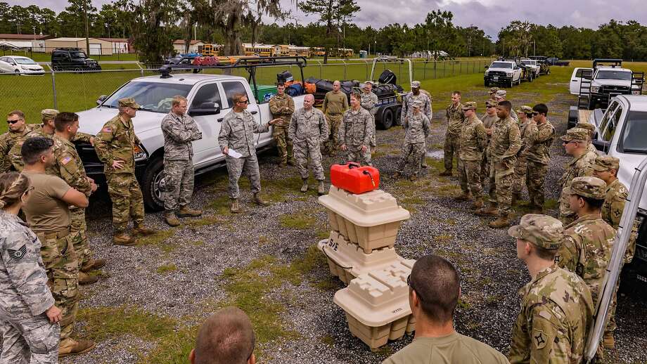 This Florida National Guard image released October 10, 2018 shows members of the Florida National Guard CBRN Enhanced Response Force Package as they prepare to help citizens in affected areas prior to landfall of Hurricane Michael on October 9, 2018 in Stark, Florida. (Photo by Ching OETTEL / Florida National Guard / AFP) / RESTRICTED TO EDITORIAL USE - MANDATORY CREDIT "AFP PHOTO / FLORIDA NATIONAL GUARD/CHING OETTEL" - NO MARKETING NO ADVERTISING CAMPAIGNS - DISTRIBUTED AS A SERVICE TO CLIENTSCHING OETTEL/AFP/Getty Images Photo: CHING OETTEL, AFP/Getty Images