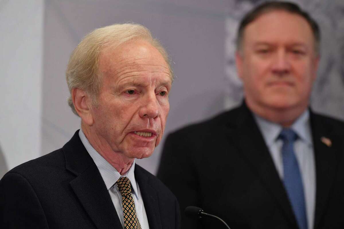 US Senator Joe Lieberman (L) introduces US Secretary of State Mike Pompeo (R) as he arrives to speak at the United Against Nuclear Iran Summit in New York on September 25.