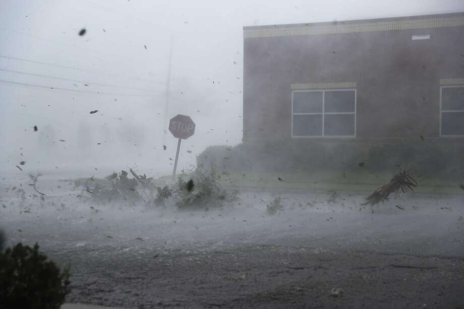 Debris is blown down a street by Hurricane Michael on October 10, 2018 in Panama City, Florida. The hurricane made landfall on the Florida Panhandle as a category 4 storm. (Photo by Joe Raedle/Getty Images) Photo: Joe Raedle, Getty Images