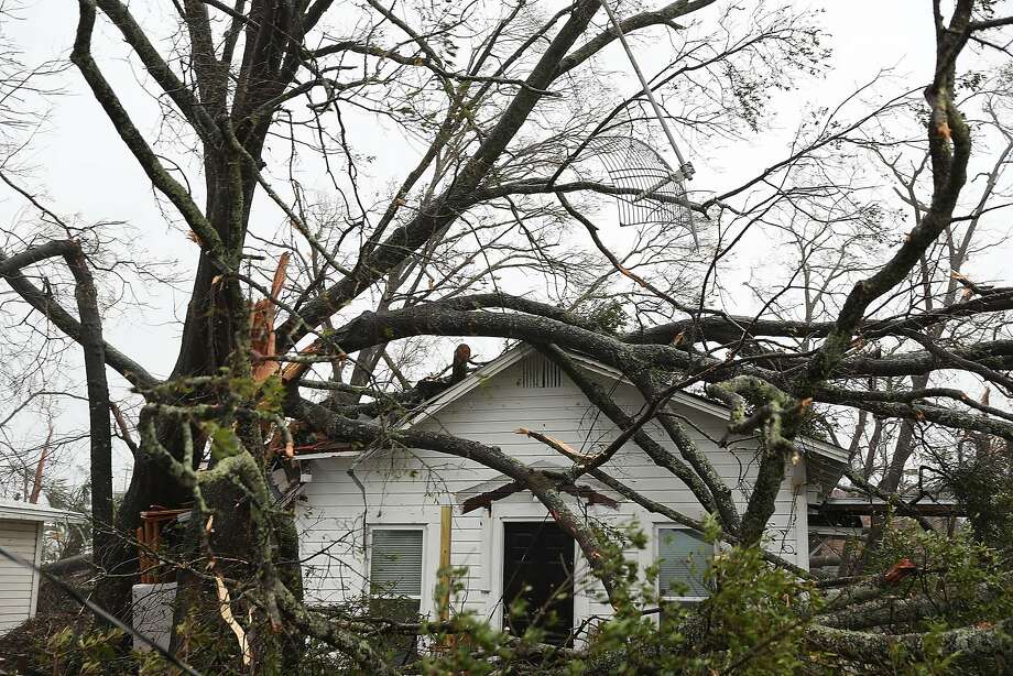 Trees lay on the top of a home after hurricane Michael passed through the area on October 10, 2018 in Panama City, Florida. The hurricane hit the Florida Panhandle as a category 4 storm.  Photo: Joe Raedle, Getty Images
