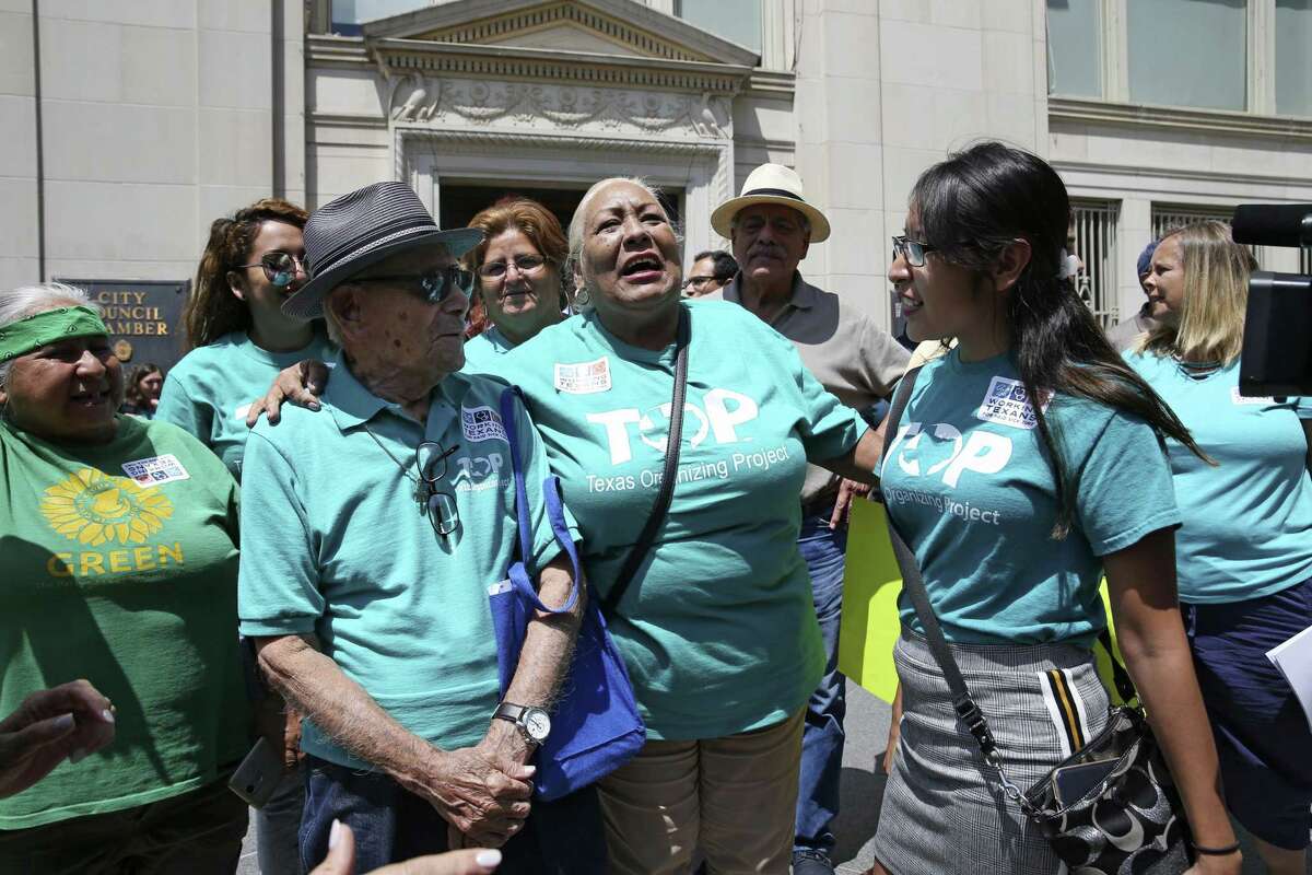 Members of Texas Organizing Project and other organizations celebrate outside the San Antonio City Council Chambers after the council passed an ordinance mandated paid sick leave, Thursday, August 16, 2018. The ordinance is scheduled to go into effect on January 1, 2019.