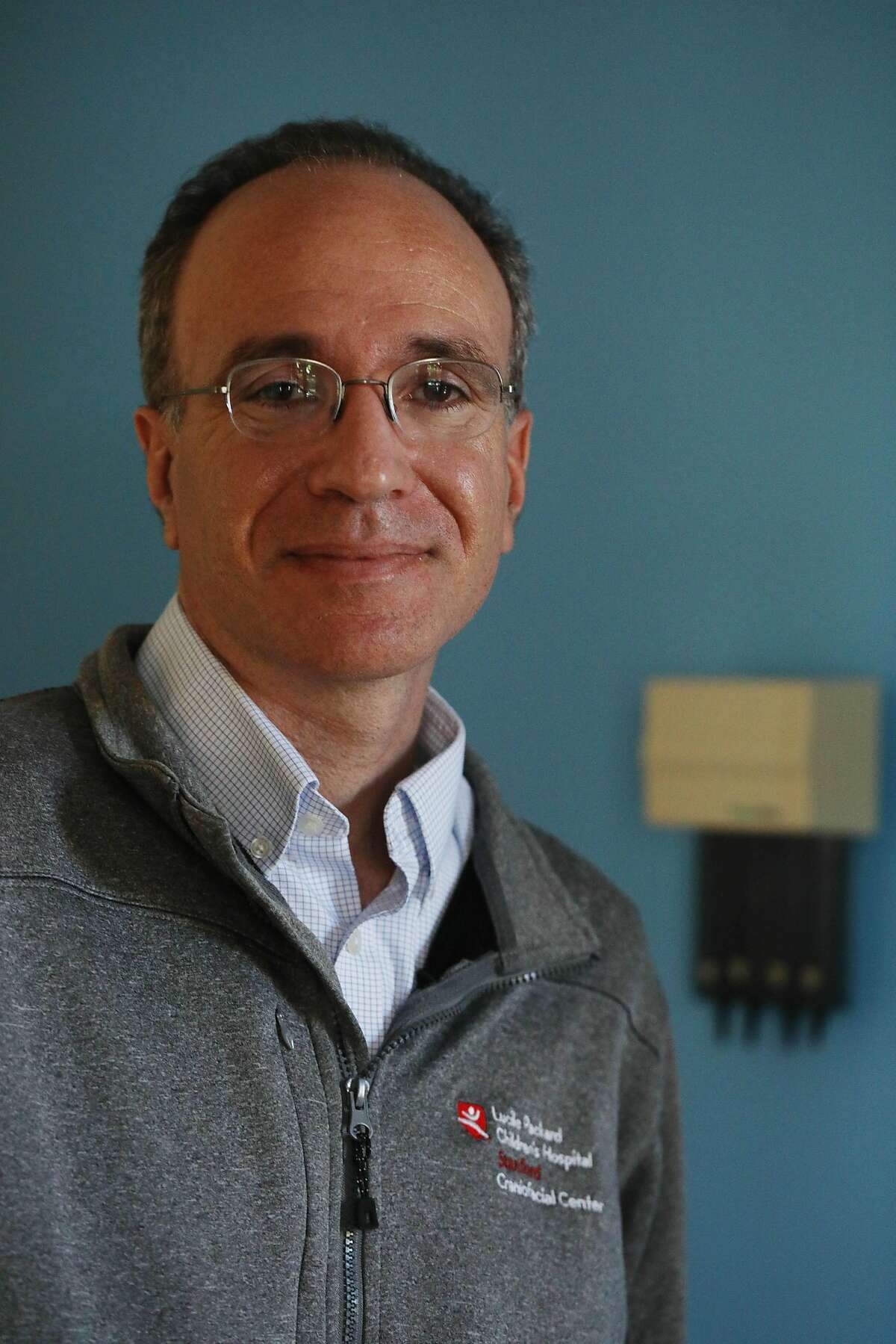 Dr. Jon Bernstein, pediatric medical director for Stanford Center for Undiasgnosed Disease, stands for a portrait at Luciele Packard Children's Hospital Outpatient Clinic on Wednesday, October 10, 2018 in Stanford.