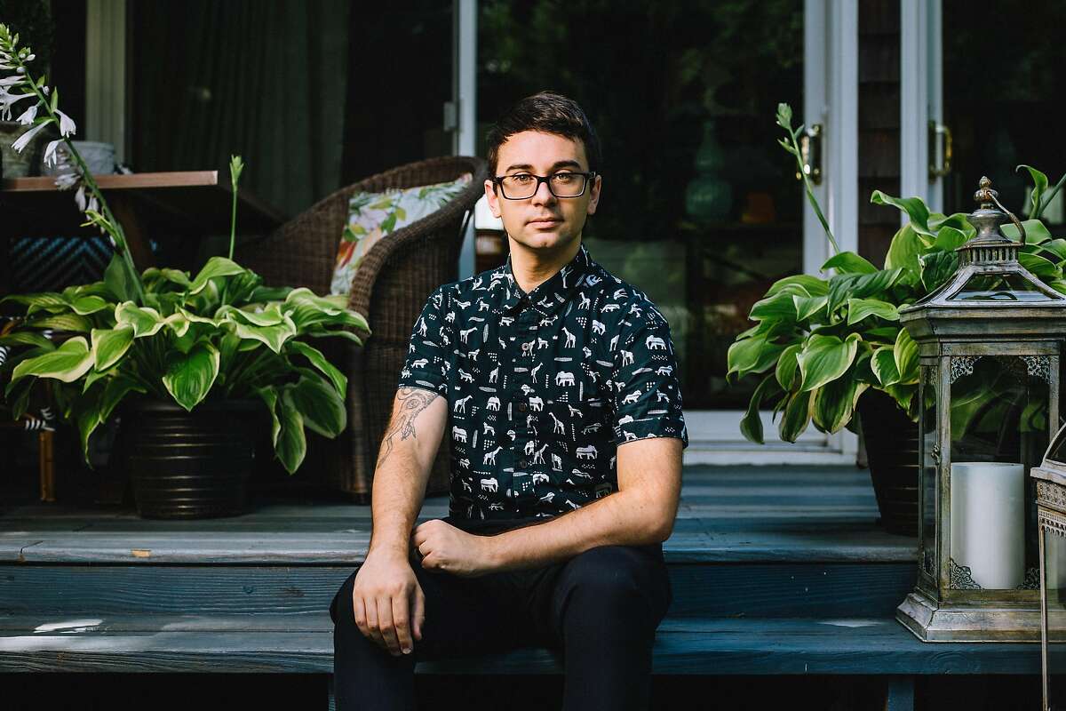 Fashion designer Christian Siriano sitting on his back porch stoop of his Danbury home.
