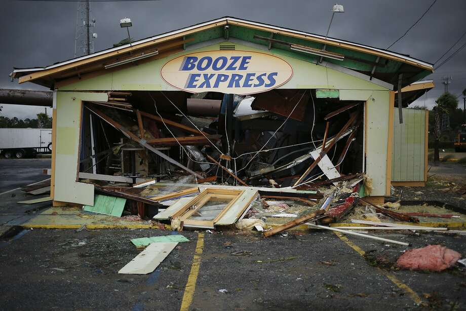 Debris lays on the ground of a Booze Express store as Hurricane Michael makes landfall in Panama City Beach, Florida, U.S., on Wednesday, Oct. 10, 2018. Investors are tracking�Hurricane�Michael�as it barrels toward Florida with winds strengthening to 145 miles per hour, posing potential consequences for companies in the building, hospital, insurance and energy industries, among others. The Category 4 storm, poised to be the strongest to hit the continental U.S. since 2004, is�expected�to make landfall Wednesday and could cause $16 billion in damage. Photographer: Luke Sharrett/Bloomberg Photo: Luke Sharrett, Bloomberg