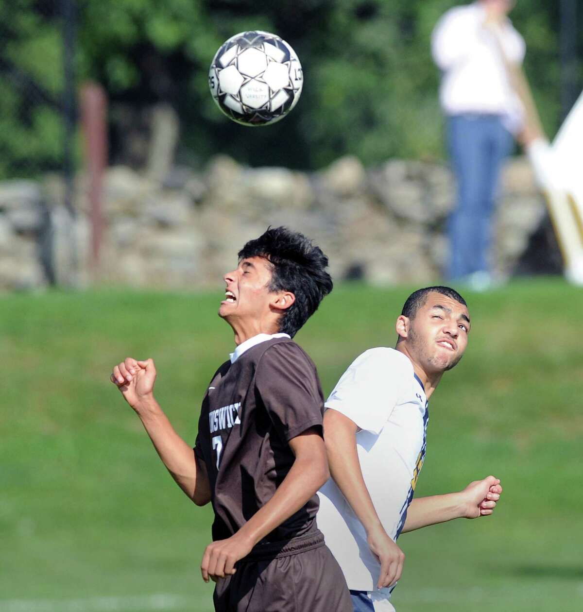 Aaryan Chinai (#7) of Brunswick, left, and a Trinity-Pawling player go to head the ball during the boys high school soccer match between Brunswick School and Trinity-Pawling School at Brunswick in Greenwich, Conn., Wednesday, Oct. 10, 2018.