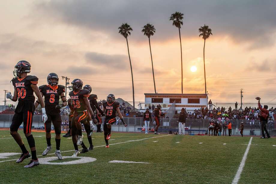 The Warriors before a high school football game between the McClymonds Warriors and Marin Catholic Wildcats at McClymonds High School on Friday, Aug. 24, 2018, in Oakland, Calif. Photo: Santiago Mejia / The Chronicle