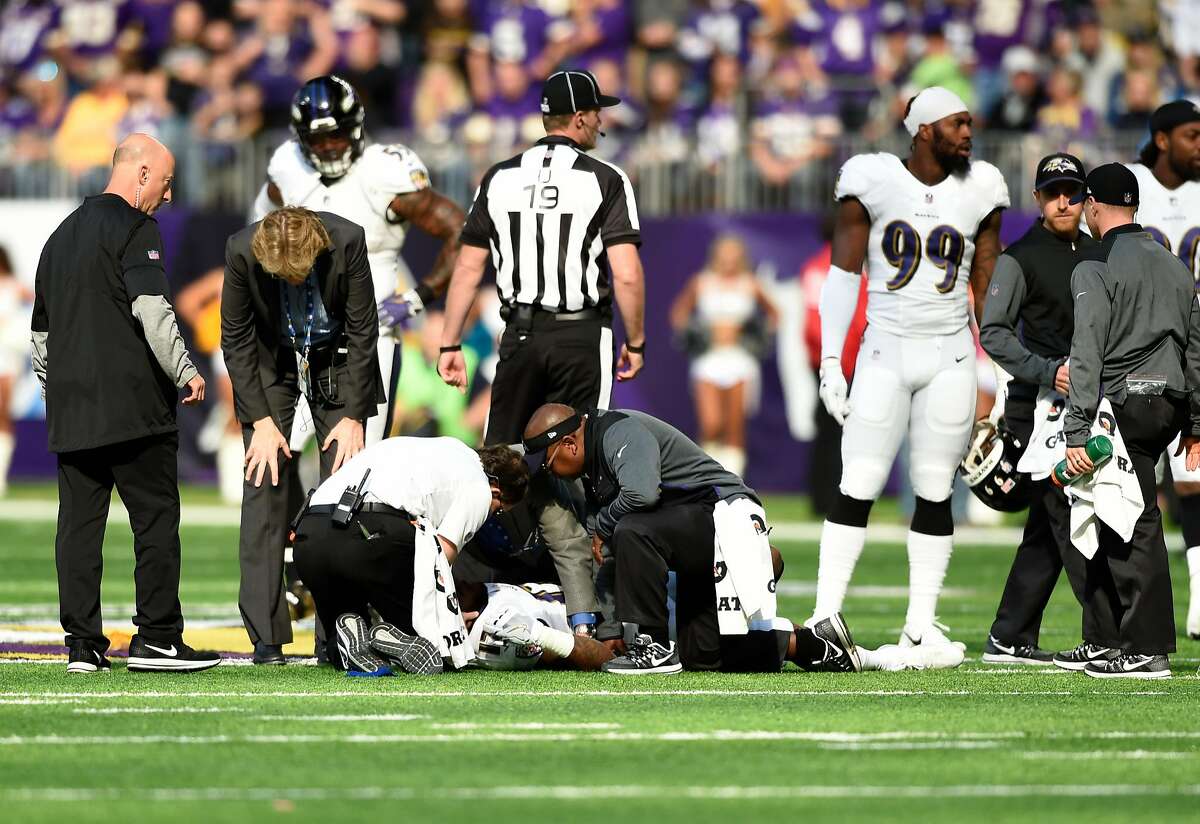 MINNEAPOLIS, MN - OCTOBER 22: Mike Wallace #17 of the Baltimore Ravens lies on the field while being assessed by medical staff in the first quarter of the game against the Minnesota Vikings on October 22, 2017 at U.S. Bank Stadium in Minneapolis, Minnesota. Wallace was ruled out of the game with a concussion. (Photo by Hannah Foslien/Getty Images)