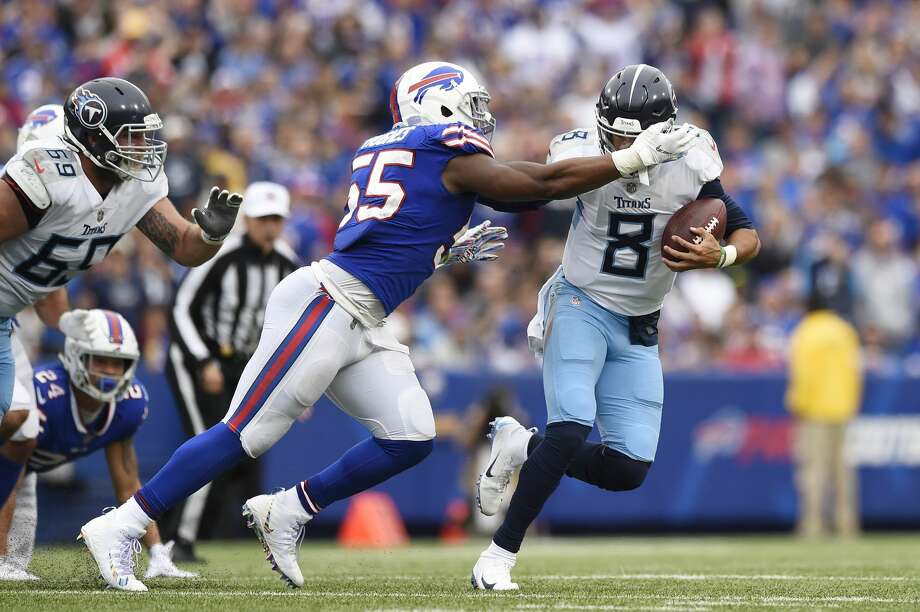 BUFFALO, NY - OCTOBER 07: Quarterback Marcus Mariota #8 of the Tennessee Titans fumbles the ball as he is sacked by defensive end Jerry Hughes #55 of the Buffalo Bills in the fourth quarter at New Era Field on October 7, 2018 in Buffalo, New York. (Photo by Patrick McDermott/Getty Images) Photo: Patrick McDermott/Getty Images