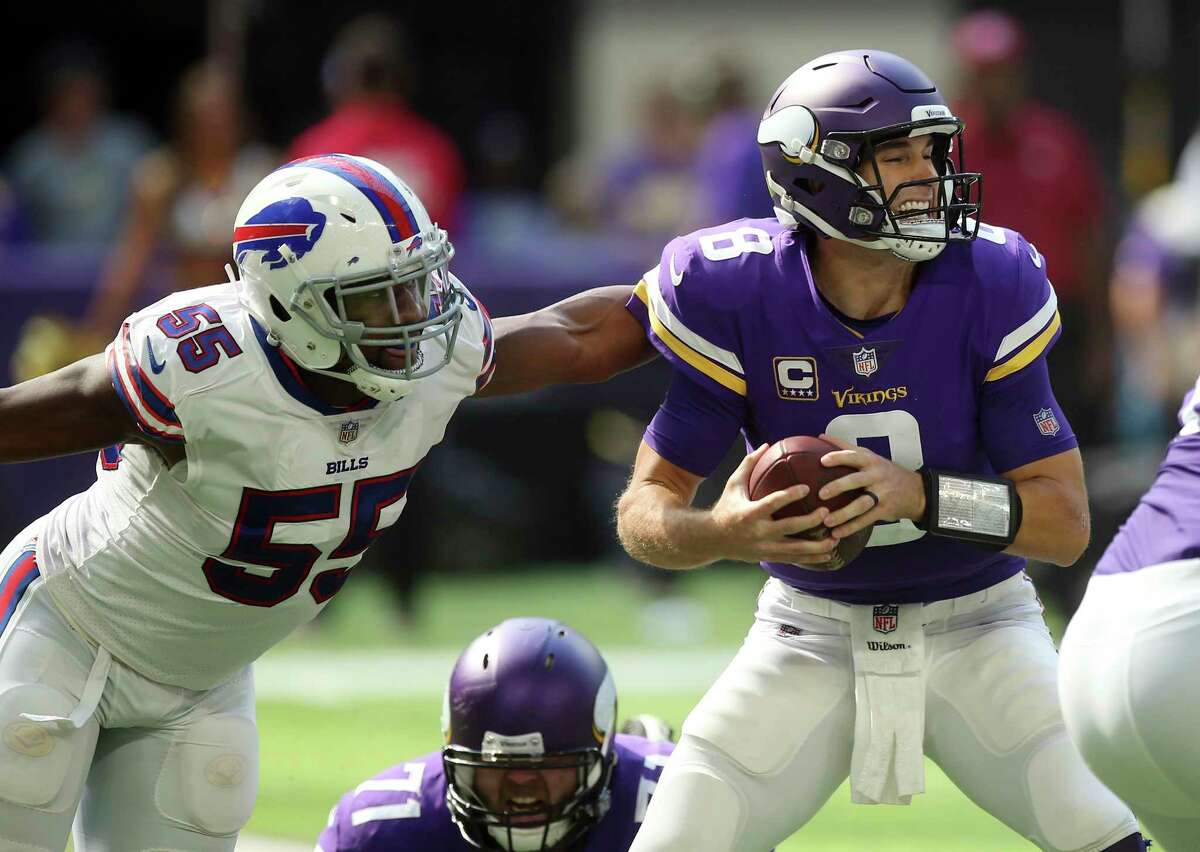 Buffalo Bills defensive end Jerry Hughes (55) pressures Minnesota Vikings quarterback Kirk Cousins (8) during the first half of an NFL football game, Sunday, Sept. 23, 2018, in Minneapolis. (AP Photo/Jim Mone)