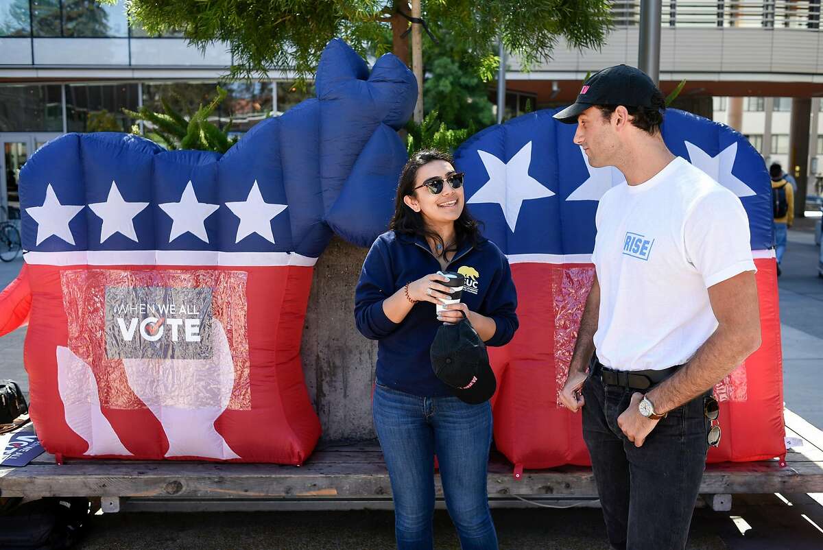 VoteCrew creator and Rise California member Maxwell Lubin, right, talks with Associated Students of the University of California external vice president Nuha Khalfay during a VoteCrew event encouraging students to vote during National Voter Registration Day on the UC Berkeley campus in Berkeley, Calif., on Tuesday September 25, 2018