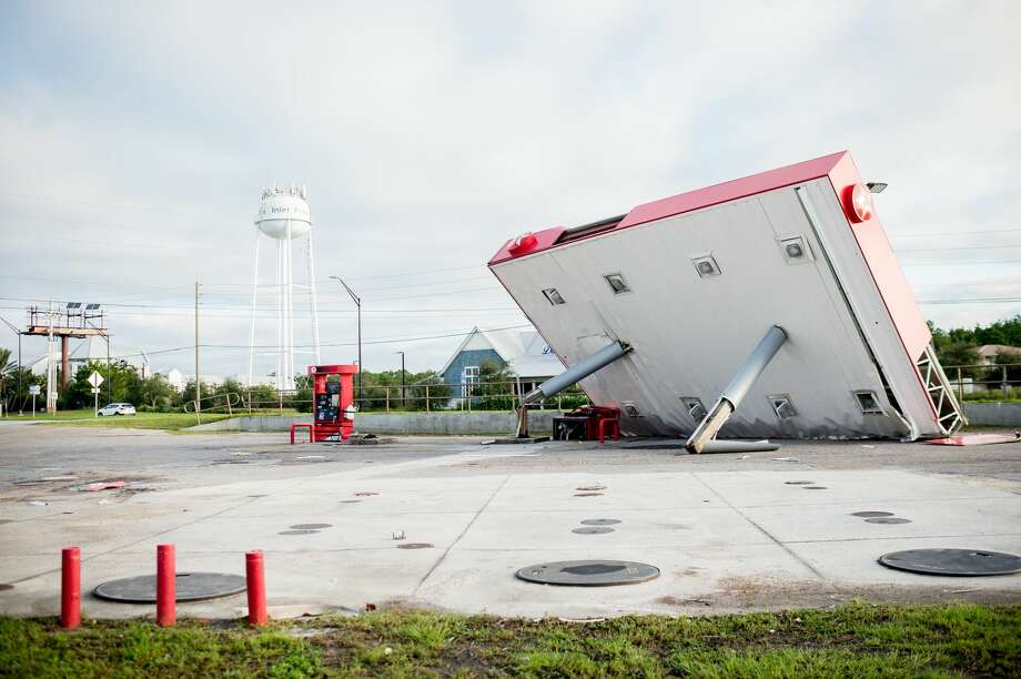 The overhang of a gas station is toppled over in the aftermath of Hurricane Michael on October 11, 2018 in Inlet Beach, Florida. - Residents of the Florida Panhandle woke to scenes of devastation Thursday after Michael tore a path through the coastal region as a powerful hurricane that killed at least two people. Photo: EMILY KASK/AFP/Getty Images