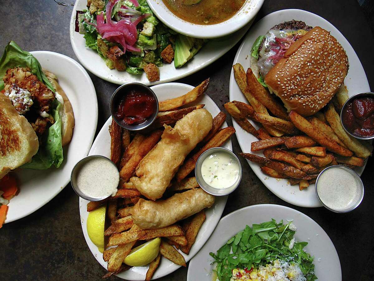 Clockwise from left: shrimp sandwich, tortilla soup, bison burger with chile-salt fries, corn salad and fish and chips from The Esquire Tavern.