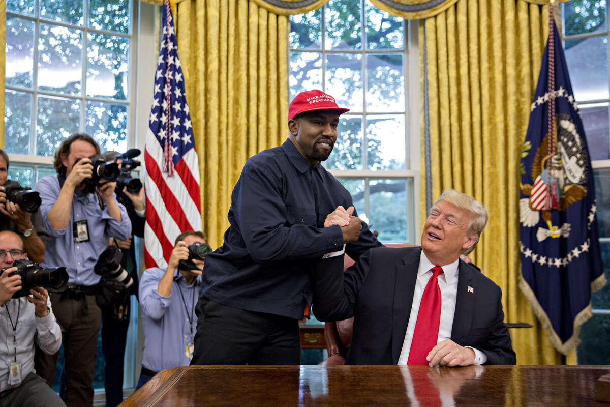 Rapper Kanye West shakes hands with President Donald Trump during a meeting in the Oval Office in the White House on Oct. 11, 2018.