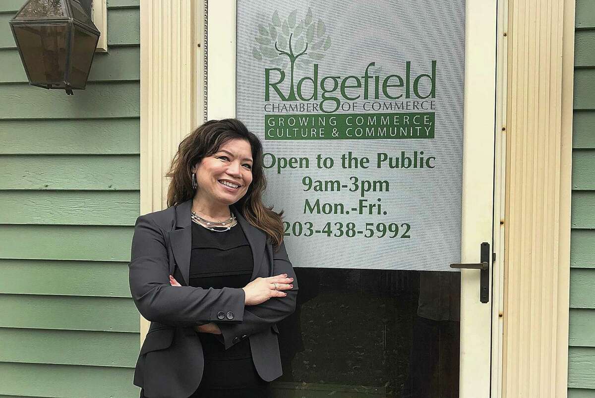 Kim Bova, new executive director of the Ridgefield Chamber of Commerce, stands outside of the organization's office in Ridgefield, Conn., on Thursday, Oct. 11, 2018.