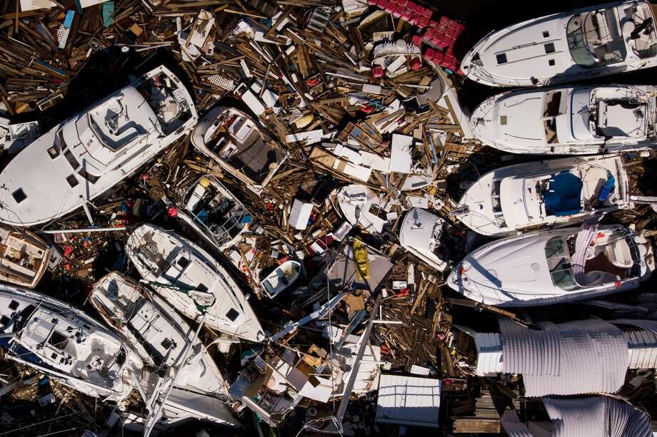 In this aerial view, storm damaged boats are seen in the aftermath of Hurricane Michael on October 11, 2018 in Panama City, Florida. - Residents of the Florida Panhandle woke to scenes of devastation Thursday after Michael tore a path through the coastal region as a powerful hurricane that killed at least two people. Photo: BRENDAN SMIALOWSKI/AFP/Getty Images