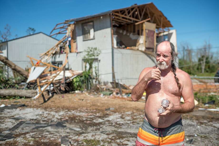 Paul Dean stands in front of his damaged property after Hurricane Michael in Panama City, Florida on October 11, 2018. - Residents of the Florida Panhandle woke to scenes of devastation Thursday after Michael tore a path through the coastal region as a powerful hurricane that killed at least two people. Photo: EMILY KASK/AFP/Getty Images