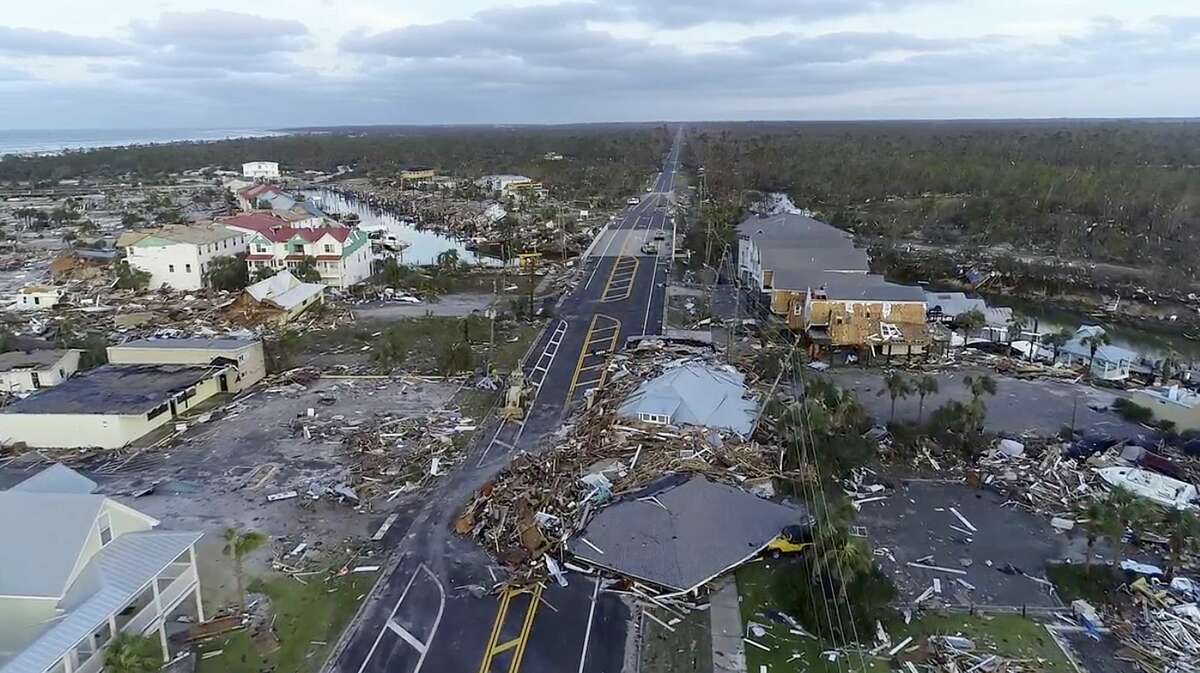 In this image made from video and provided by SevereStudios.com, damage from Hurricane Michael is seen in Mexico Beach, Fla. on Thursday, Oct. 11, 2018. Search-and-rescue teams fanned out across the Florida Panhandle to reach trapped people in Michael's wake Thursday as daylight yielded scenes of rows upon rows of houses smashed to pieces by the third-most powerful hurricane on record to hit the continental U.S. (SevereStudios.com via AP)