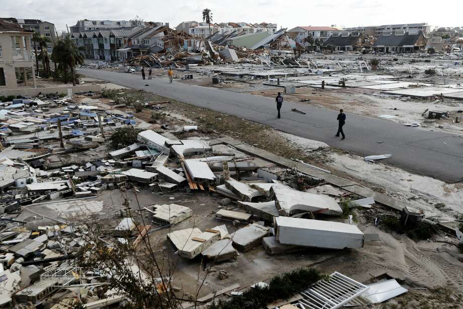 Rescue personnel search amidst debris in the aftermath of Hurricane Michael in Mexico Beach, Fla., Thursday, Oct. 11, 2018. (AP Photo/Gerald Herbert) Photo: Gerald Herbert/AP