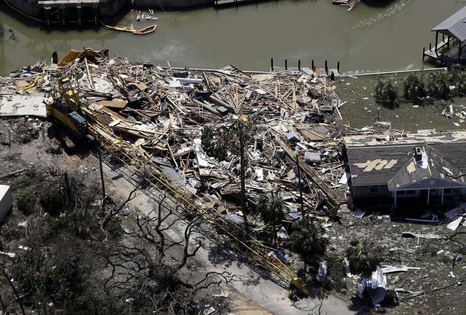 Debris from Hurricane Michael fills a lot Thursday, Oct. 11, 2018, in Mexico Beach, Fla. Hurricane Michael made landfall Wednesday as a Category 4 hurricane with 155 mph (250 kph) winds and a storm surge of 9 feet (2.7 meters). (AP Photo/Chris O'Meara) Photo: Chris O'Meara/AP
