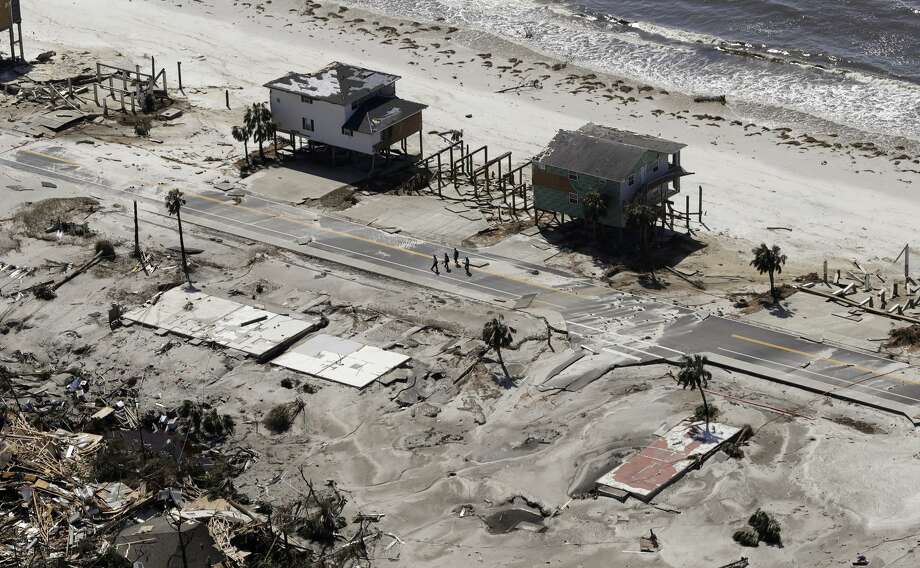 Homes are left swept off their foundations from the effects of Hurricane Michael, Thursday, Oct. 11, 2018, in Mexico Beach, Fla. Michael made landfall Wednesday as a Category 4 hurricane with 155 mph (250 kph) winds and a storm surge of 9 feet (2.7 meters). (AP Photo/Chris O'Meara) Photo: Chris O'Meara/AP