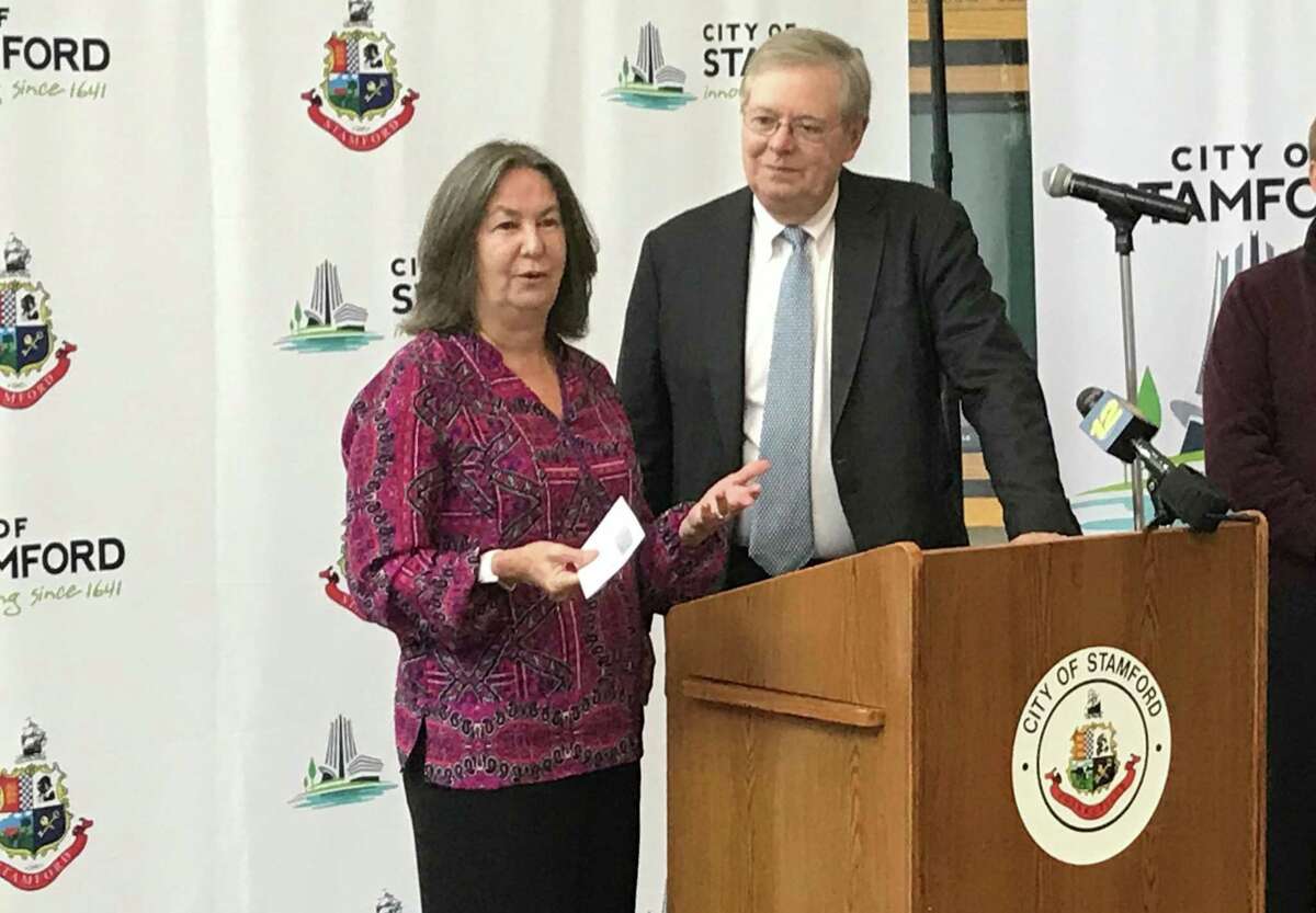 Marti Etter, executive director of the Ballet School of Stamford, thanks Mayor David Martin for the city's support during a presentation of the city's Community Arts Partnership Program grants on Thursday, Oct. 11, 2018.